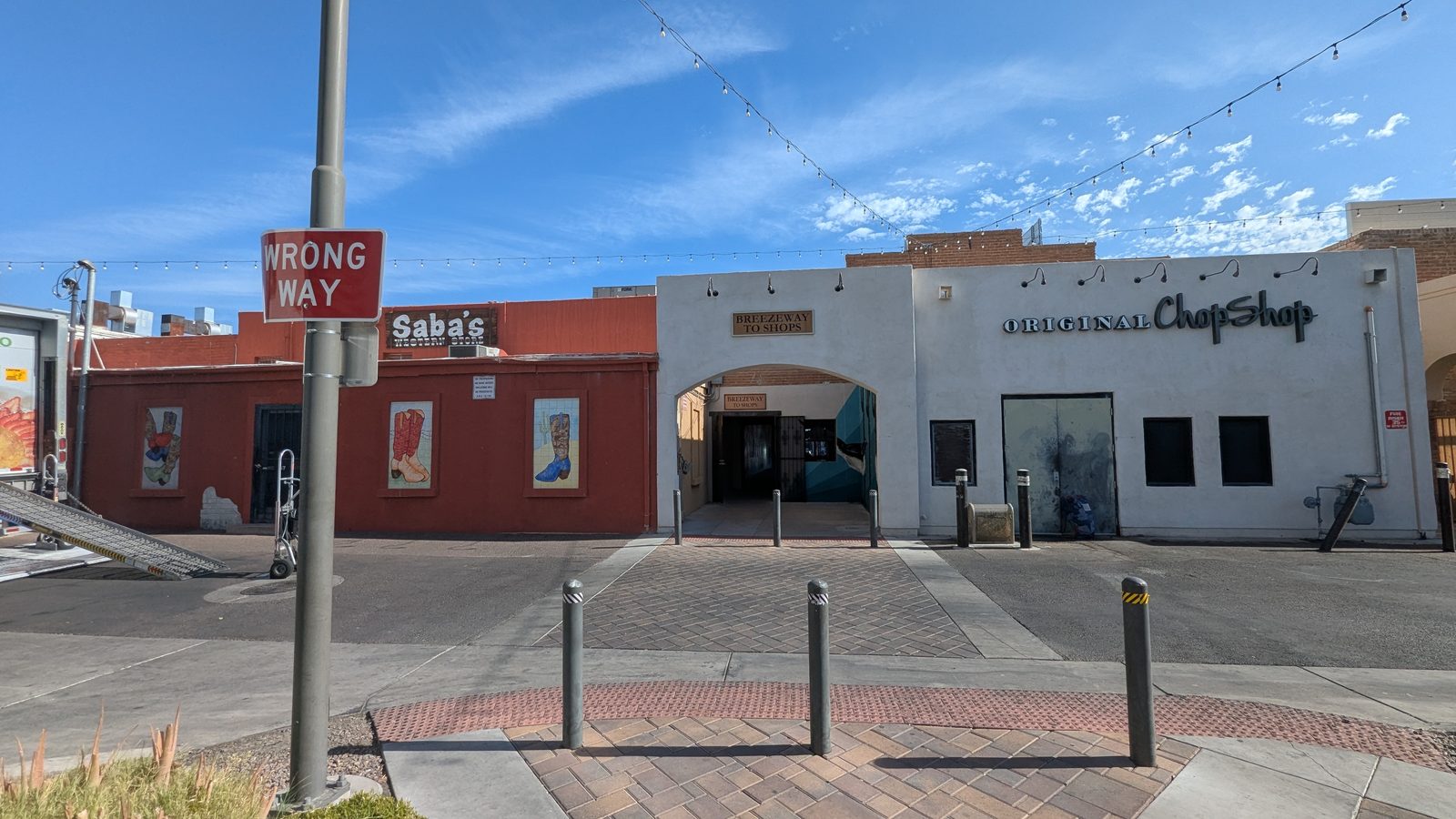 The Breezeway to Shops archway between Saba's Western Wear and the Original ChopShop